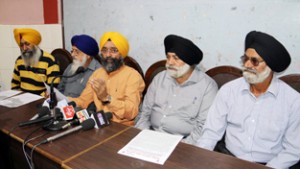 DGPC gen secy Avtar Singh Khalsa with other members addressing press conference in Jammu on Tuesday. -Excelsior/ Rakesh
