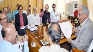 Minister for Public Works Ab. Rehman Veeri chairing a meeting of officers in Jammu on Tuesday.