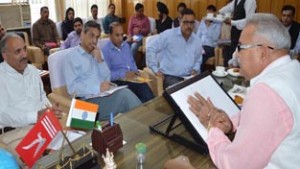 PHE Minister Sham Choudhary chairing a meeting at Jammu on Tuesday.