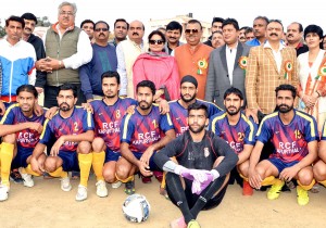 Footballers posing along with Minister for Industries and Commerce, Chander Parkash Ganga in Jammu on Saturday.