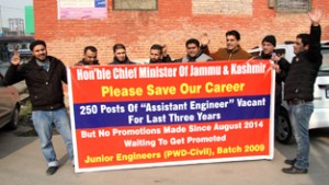 Junior Engineers of R&B Department staging protest in Srinagar on Saturday. -Excelsior/Shakeel