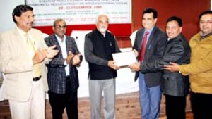 SKUAST-J VC presenting best centre award to Dr Daleep Kachroo on Sunday.