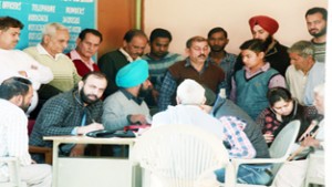 HoD Cardiology Dr Sushil Sharma examining patients at Akalpur on Sunday.