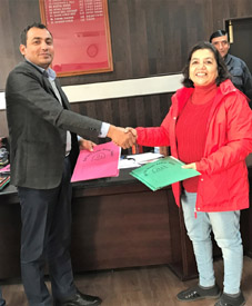 Deputy Commissioner Reasi Ravinder Kumar and Savita Jhingan, Head of Operations MH One TV during exchange of agreement on Tuesday.