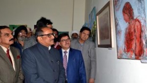Deputy Chief Minister Dr Nirmal Singh during art exhibition at Jammu on Tuesday.