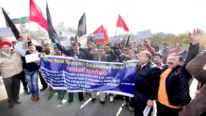 J&K SRTC workers taking out protest rally in Jammu on Tuesday. -Excelsior/ Rakesh