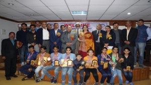 Meritorious sport climbers and mountaineers posing alongwith Chief Secretary BR Sharma and other dignitaries during prize distribution function. 