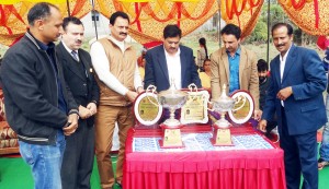  Divisional Sports Officer (J) State Sports Council, Ravi Singh and ace former cricketer Ashwani Gupta alongwith other dignitaries unveiling trophies while inaugurating Chief Minister's Cup at Gharota in Jammu.  