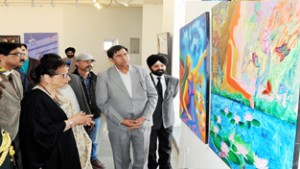 Usha Vohra, First Lady viewing art works at Kala Kendra in Jammu on Saturday.