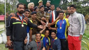 Jubilant J&K Police team posing for a photograph while receiving trophy at DPL Kathua on Wednesday.