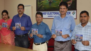 Chief Electoral Officer Shantmanu and others releasing informative Compact Disc (CD) on Wednesday.