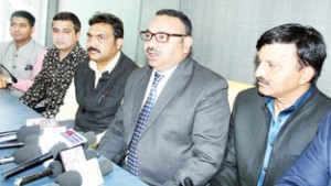 President Chamber of Commerce and Industries, Rakesh Gupta with his new team at a press conference in Jammu  on Monday.       -Excelsior/ Rakesh 