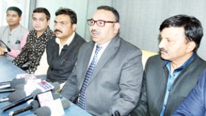President Chamber of Commerce and Industries, Rakesh Gupta with his new team at a press conference in Jammu on Monday. -Excelsior/ Rakesh