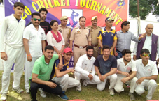 Winners Singh Cricket Club Akhnoor players posing for a group photograph in Jammu on Friday.