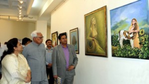 Governor N N Vohra having a look at the  paintings at Kala Kendra on Saturday.