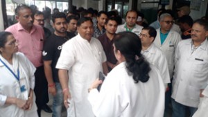 MLA Sat Sharma interacting with Principal GMC Jammu and Medical Superintendent of the Hospital after the meeting of Hospital Development Board on Monday.