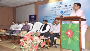 MLA Gagan Bhagat speaking at launch of e-Rural Mela at RS Pura on Wednesday.