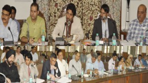 Coordinator, Chief Minister’s Grievance Cell, Tassaduq Mufti chairing a meeting at Srinagar on Thursday. 