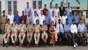 Experts and participants posing for a group photograph on conclusion of workshop at Police Academy Udhampur on Thursday.