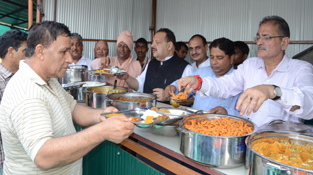 Kavinder Gupta, Sat Sharma and Devender Rana serving Langar to devotees on Monday.