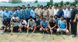Winning team posing for group photograph.