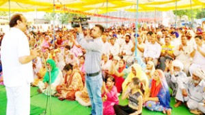 Former minister, Surjeet Singh Slathia addressing a public gathering at Ramgarh on Sunday. -Excelsior/Gautam