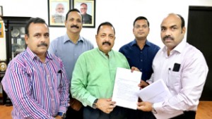 Union Minister Dr Jitendra Singh receiving a memorandum from a delegation of UP Provincial Civil Service officers, led by Prabhashu Srivastava, at New Delhi on Sunday.