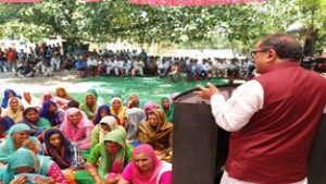 Deputy Chief Minister Dr Nirmal Singh addressing public gathering in Billawar on Friday.