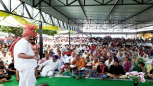 Former minister and senior NC leader Surjeet Singh Slathia addressing party workers at Nandpur, Ramgarh on Monday.