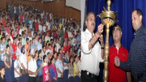 Dignitaries lighting lamp to declare open the celebrations of students' victory by VMC Jammu at General Zorawar Singh Auditorium, University of Jammu on Sunday.  — Excelsior/Rakesh