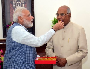 President elect Ramnath Kovind being offered sweets by Prime Minister Narendra Modi, in New Delhi on Thursday. (UNI) 