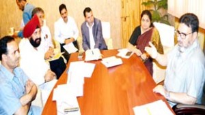 Minister for Education, Altaf Bukhari chairing a meeting at Srinagar on Friday.