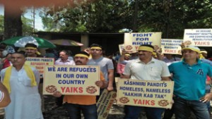 Representatives of YAIKS and Valley posted migrant employees protesting in front of Relief Organisation on Friday. — Excelsior/Rakesh