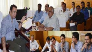Minister for FCS&CA Ch Zulfkar Ali chairing a meeting at Srinagar on Thursday.