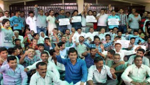 NPP activists staging protest dharna at DSE complex Muthi in Jammu on Thursday. -Excelsior/ Rakesh