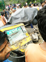 An Autorikshaw extensively damaged in landslides near Darshni Deodi in Katra on Wednesday.— Excelsior/Mengi