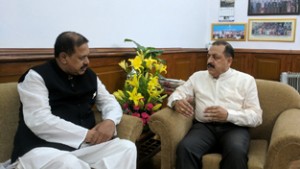 Union Minister Dr Jitendra Singh being briefed about GST implementation in Sikkim by BJP's GST awareness campaign Incharge and State Party General Secretary, Shyamal Pal, at New Delhi on Friday.