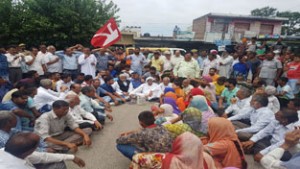 Former Minister and senior NC leader Ajay Sadhotra and others during protest at Marh on Thursday.