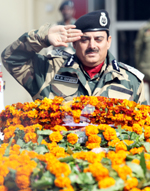 DG BSF K K Sharma salutes the martyr BSF jawan in Jammu on Thursday. -Excelsior/Rakesh