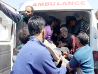 A civilian injured in South Kashmir being admitted in SMHS hospital, Srinagar on Sunday. —Excelsior/Shakeel