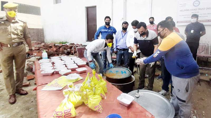 Packed lunch being prepared for needy persons. 