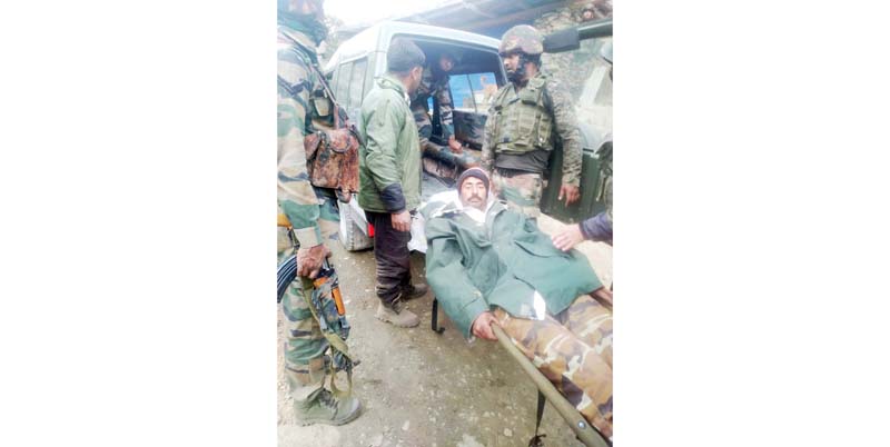 An injured BSF porter being taken to hospital in Poonch on Friday.-Excelsior/ Gurjeetbhajan