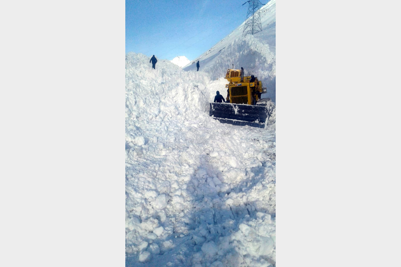 Snow clearance work in progress on Mughal Road in Poonch sector.