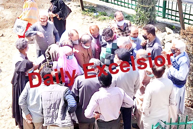 People waiting for vaccination at a health facility in Srinagar on Thursday.-Excelsior/Shakeel