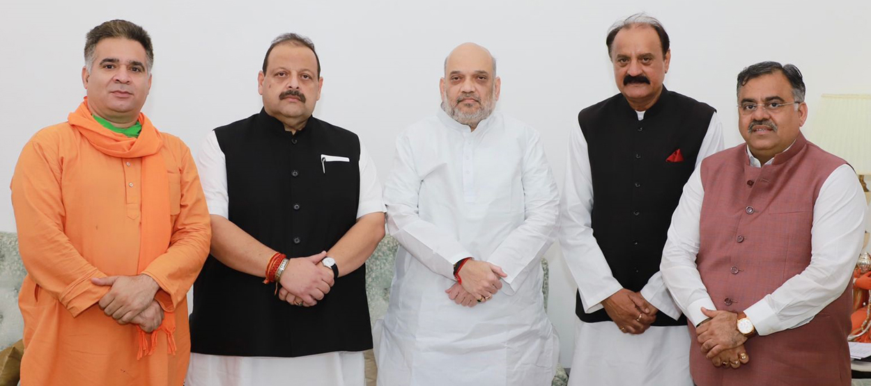 Devender Rana and Surjit Singh Slathia with Home Minister Amit Shah and other BJP leaders in New Delhi on Monday. 