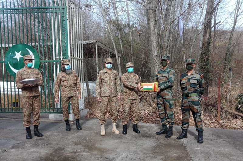  Exchange of sweets and greetings between Indian and Pakistan Armies at the border post in Poonch on Saturday. (UNI)
