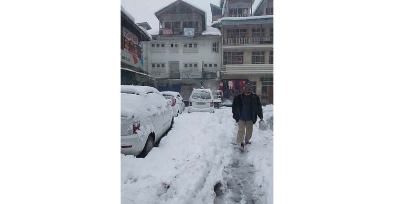 A view of snow clad Seri Bazar at Bhaderwah on Sunday. -Excelsior/Tilak Raj