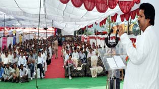 Minister for Housing Raman Bhalla addressing farmers at Panchari on Sunday.