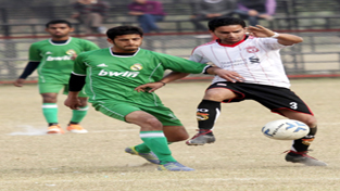 Footballers battling for getting hold of the ball during a match of 4th Sher-e-Kashmir Gold Cup at GGM Science College on Saturday. -Excelsior/ Rakesh