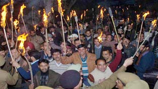 Employees taking out `Mashal’ rally towards CM’s residence in Jammu on Wednesday. -Excelsior/ Rakesh